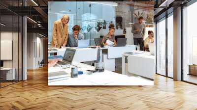 Busy day. Group of multiracial business people working together in the creative co-working space Wall mural