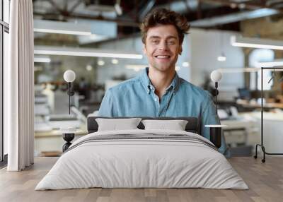 Enjoying office life. Joyful businessman posing in office Wall mural