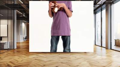 Full length shot of happy teenaged disabled boy with cerebral palsy smiling at camera, holding his teddy bear toy, standing isolated over white background Wall mural