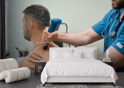 Patient being treated for dorsodynia by physical therapist in clinic Wall mural