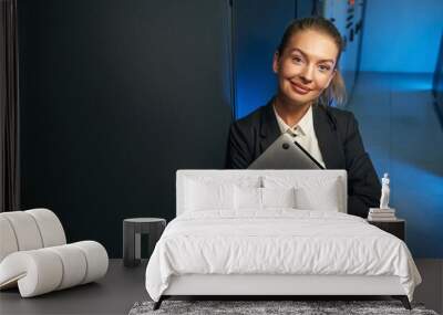 Photo of cheerful woman network engineer in data center Wall mural