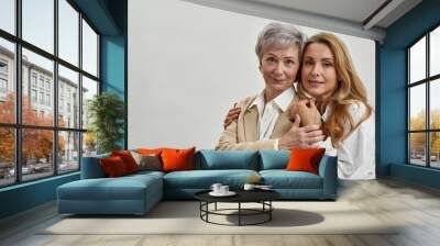 Portrait of happy loving two generations mother and daughter Wall mural