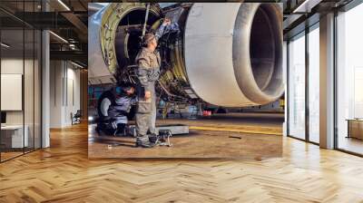 View of airplane and engine mechanisms on the wing in the indoors Wall mural