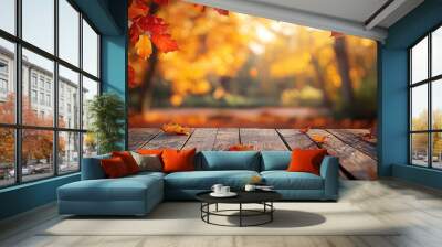 Wooden table and blurred Autumn background. Autumn concept with red-yellow leaves background. Wall mural