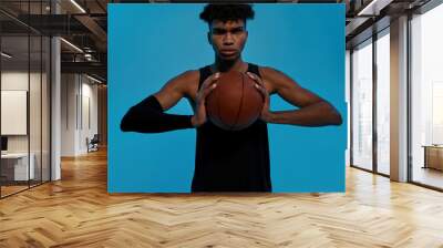 Young black male player hold basketball ball Wall mural