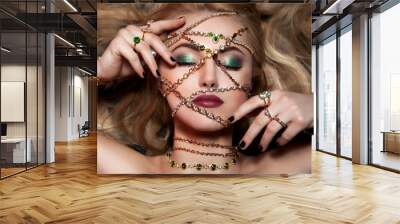 Art portrain of woman with glamout make up and fashion jewelry. Wall mural