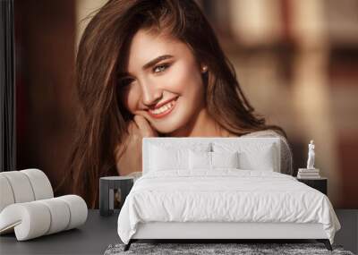 Young pretty woman with natural beauty smilling at camera. Youth and happiness concept. Wall mural