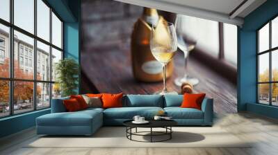 Two glasses of champagne at a window Wall mural