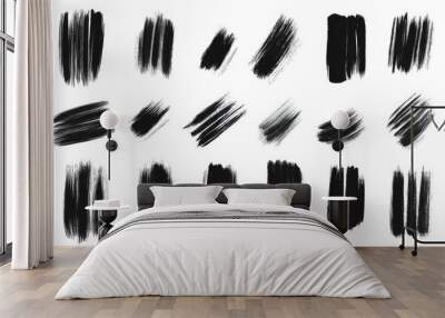 A collection of black brush strokes, some of which are long and thin, while others are short and thick. The strokes are scattered across the image, creating a sense of movement and energy Wall mural