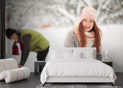 Snowball fight on the New Year Eve. But these two are very happy. Wall mural