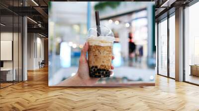 Iced Boba/Bubble Milk tea. A plastic cup of milk tea with boba/bubble tapioca pearls and brown sugar syrup, topped with milk foam. Wall mural