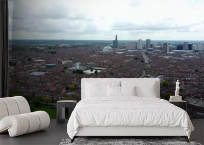  Bustling cityscape under a cloudy sky Wall mural