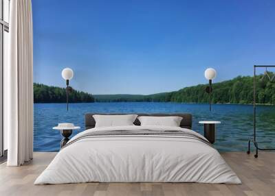  Tranquil lake view under a clear blue sky Wall mural