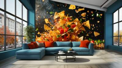 A vibrant explosion of tortilla chips topped with fresh tomatoes and herbs, showcasing an appetizing culinary moment. Wall mural