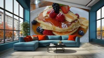 Pancakes, soft and stackable, are enjoyed with a variety of toppings such as butter, syrup, and fruit Wall mural