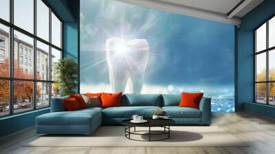 Sparkling white tooth radiating with ethereal light, creating an aura of freshness and wellness against a calming blue background Wall mural