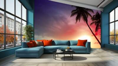 Palm trees and sunset on Caribean. Wall mural