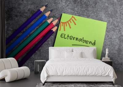 Concept of Kreidetafel mit bunter kreide und Elternabend write on sticky notes isolated on Wooden Table. Wall mural