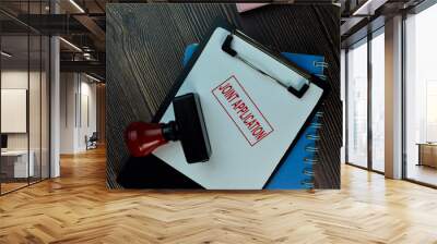 Red Handle Rubber Stamper and Joint Application text isolated on the table. Wall mural