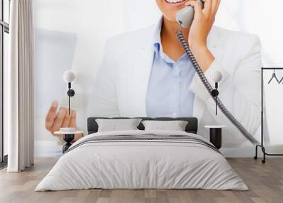 african businesswoman with phone in office Wall mural