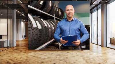 auto business owner and wheel tires at car service Wall mural