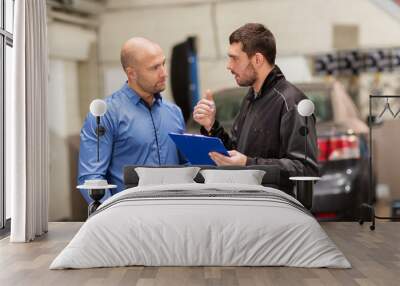 auto mechanic and customer at car shop Wall mural