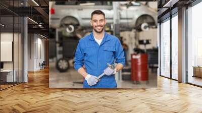 auto mechanic or smith with wrench at car workshop Wall mural