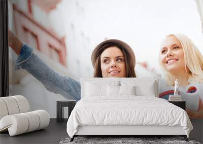 beautiful girls looking for direction in the city Wall mural