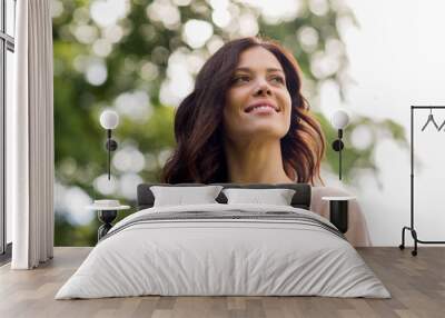 beautiful happy young woman outdoors at summer Wall mural