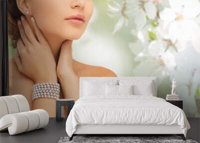 beautiful woman with pearl earrings and bracelet Wall mural