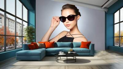 beautiful young woman in elegant black sunglasses Wall mural