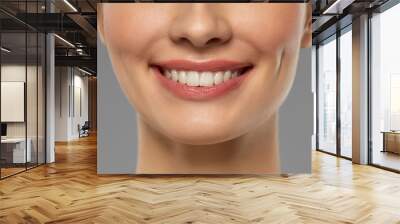 beauty, dental care and teeth whitening concept - close up of beautiful young woman with white smile over grey background Wall mural