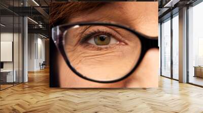 beauty, vision and old people concept - close up of face of senior woman in glasses Wall mural