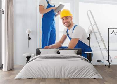 builders with tablet pc and equipment indoors Wall mural