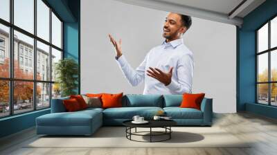 business, office worker and people concept - happy indian businessman in shirt over grey Wall mural