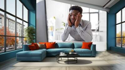 business, people, deadline and technology concept - stressed african american businessman with computer and papers at office Wall mural