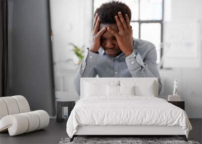 business, people, deadline and technology concept - stressed african american businessman with papers at office Wall mural