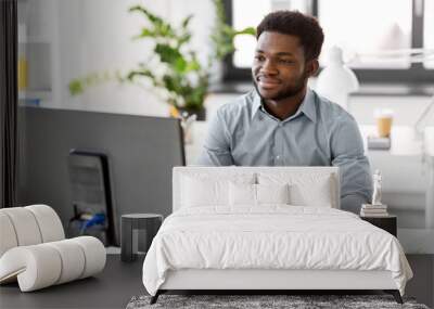 business, people and technology concept - african american businessman with computer working at offi Wall mural