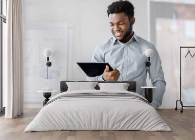 business, people and technology concept - african american businessman with tablet pc computer at office Wall mural