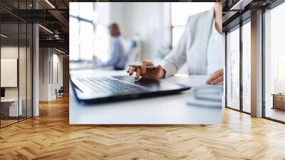 business and people concept - businesswoman with laptop computer and papers working at office Wall mural