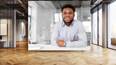 business and people concept - smiling african american businessman at office Wall mural