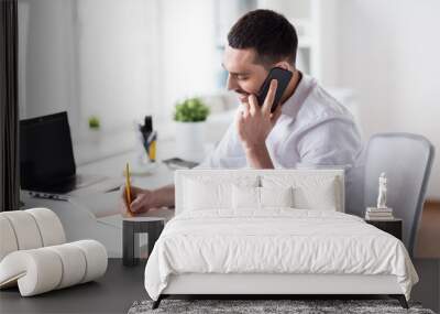 businessman calling on smartphone at office Wall mural