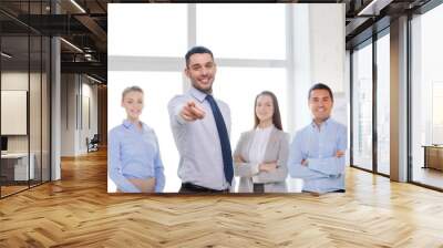 businessman in office pointing finger at you Wall mural