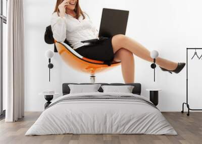 businesswoman in chair with laptop and phone Wall mural