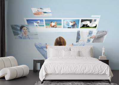 businesswoman watching video media files Wall mural