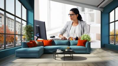 businesswoman with computer working at office Wall mural