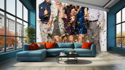 celebration, people and holidays concept - happy friends at party under falling confetti over white background Wall mural