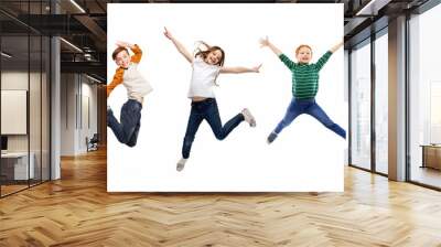 childhood, fun and motion concept - happy children jumping over white background Wall mural