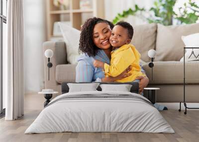 childhood, kids and people concept - happy african american mother with her baby son at home Wall mural