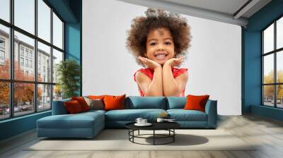 childhood and people concept - happy little african american girl over grey background Wall mural